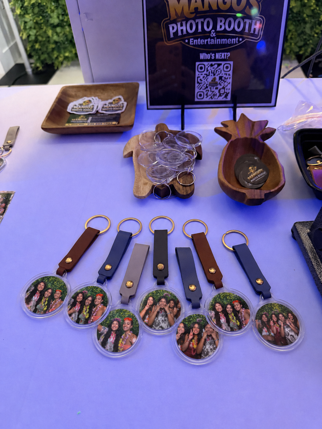 Mango's personalized photo keychains and keepsakes displayed at a Memory Station